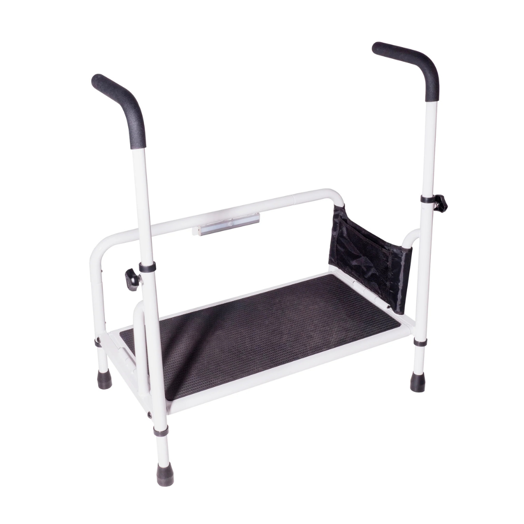 The Stander Step Bedside Platform with LED Lighting is a white bed safety step with two side handles, a non-slip black platform, and a small black storage pouch to assist with getting in and out of bed or elevated surfaces.